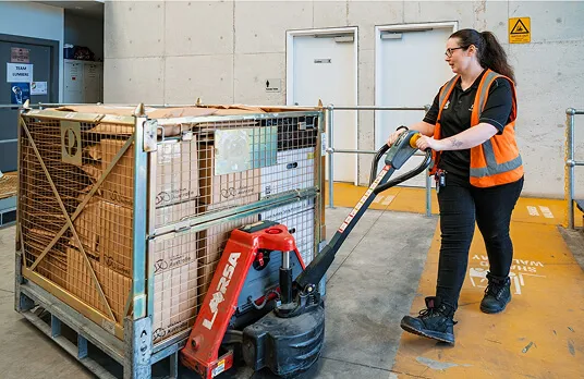 Hone supported employee moving product in warehouse