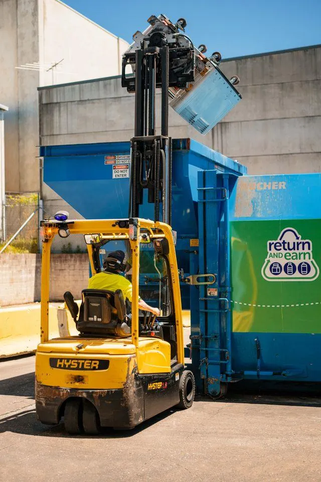 Return and Earn forklift - operator with disability