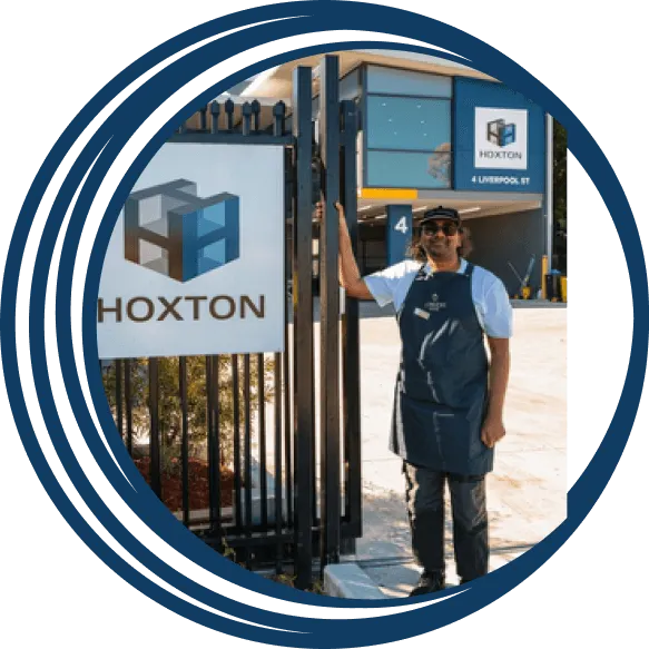 Supported employee standing out the front of the Hone warehouse