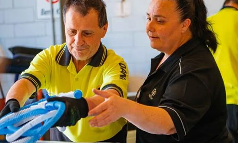 Hone supported employee in warehouse recycling plastic goods