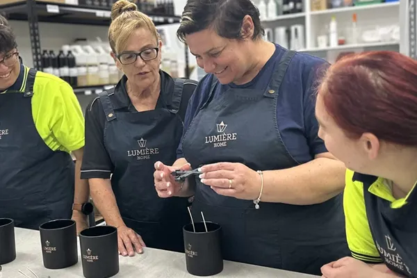 Lumiere employee making candles - 4 female workers