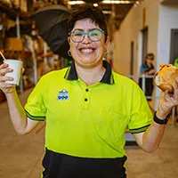Female employee with food and drinks