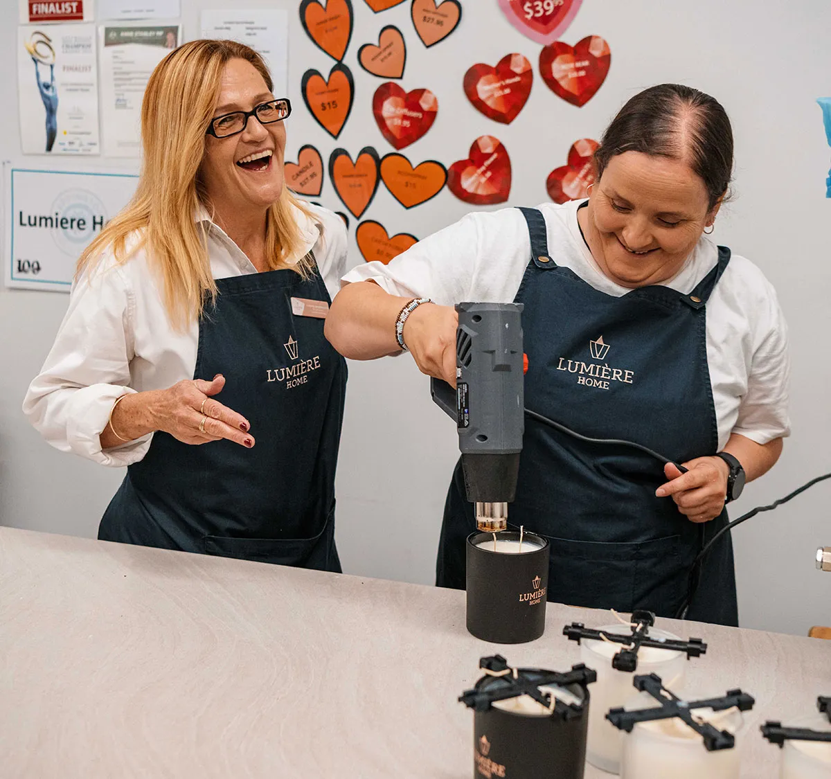 Lumiere staff members creating candles