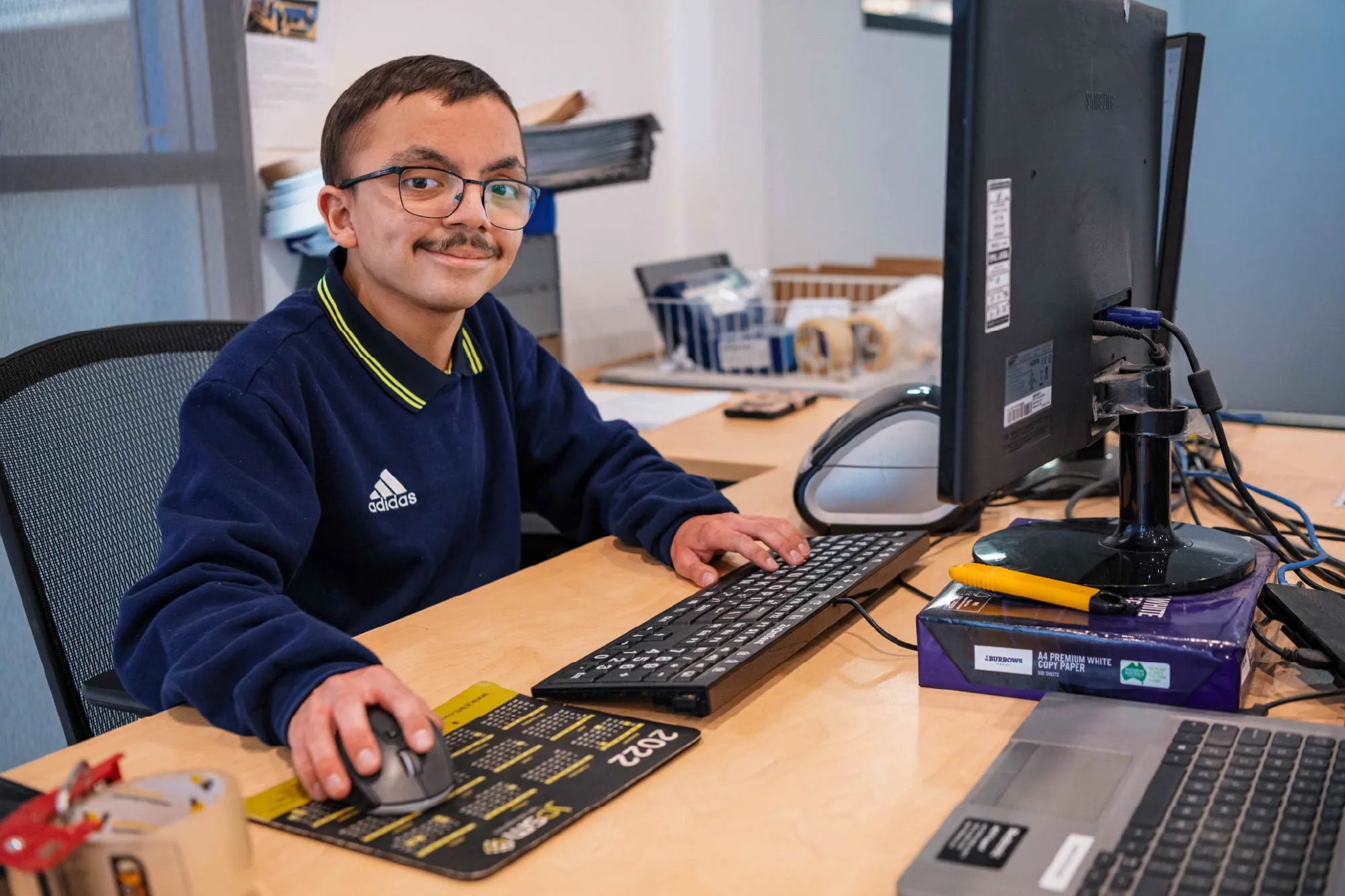 Hone supported employee on computer working