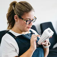 Lumiere staff member working the eftpos machine