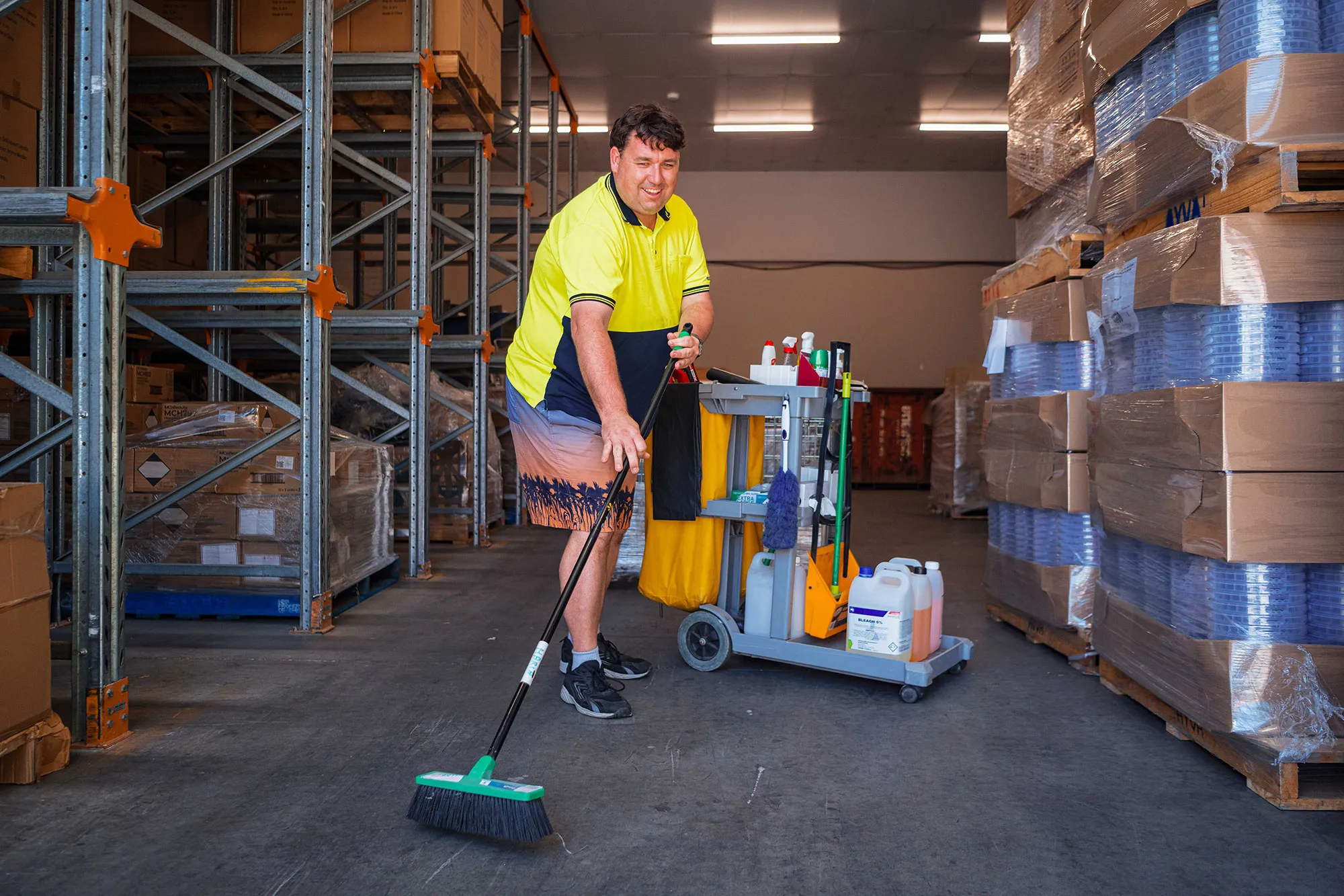 Hone supported worker sweeping up the factory floor