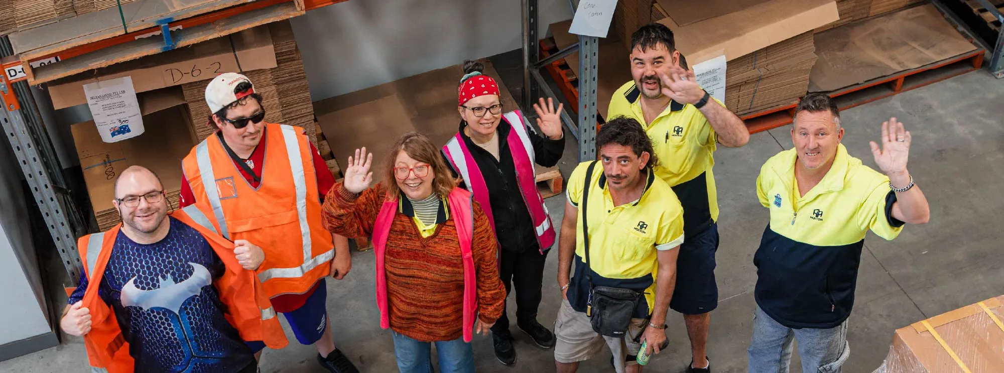Hone 3PL. Destruction, Packing and Lumiere Staff Members. Waving and smiling