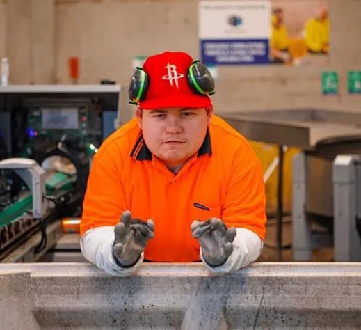 Hone supported employee in warehouse with hat and gloves on